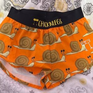 Women’s ChicknLegs Orange Snail Print Shorts
